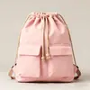 2026 Estilo Nuevo Bolsa de Lona Sencilla con Cordón Mochila para Estudiante de Escuela Primaria de Viaje Mochila Ligera Bolsa de Tela de Bolsillo Bolso de Doble Hombro