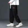 Calças casuais de veludo cotelê para outono para homens, novas calças jogger de retalhos de chenille com corte solto, calças de moletom esportivas de marca da moda