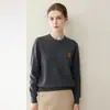 Suéter de punto cálido de cachemira popular de alta gama con cuello redondo bordado 100% cachemira pura, elegante, cómodo, de corte holgado