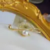 Broche de perla nota otoño e invierno de alta gama para mujer, exquisito, diseño de nicho, temperamento, accesorios de pin para traje de ropa de alta gama