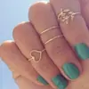 En 2015, AliExpress vendió decenas de miles de anillos de cuatro piezas con hojas populares, clavos de comercio exterior europeos y americanos J004.