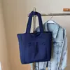 Bolsa Tote Grande Capacidade Estilo Coreano para Estudante Feminina Tendência Nova Artística Estilo Harajuku Bolsa de Lona Casual Cor Sólida Bolsa de Ombro