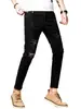 Calça de ganga masculina estilo coreano, de nove pontos, com rasgos, corte slim, perna afunilada, elástica, para primavera e outono, novo estilo branco, calça de nove pontos desgastada