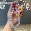 Pulseira de Pulso Popular para Celular com Borboleta Pintada em Acrílico no TikTok - Versátil e Universal para Capas de Celular, Pingentes de Mão, Corrente Anti-Perda
