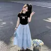 Conjunto Ligero de Verano para Niñas: Conjunto de Dos Piezas: Camiseta de Manga Corta con Lazo Dulce y Lindo y Falda Elegante Femenina