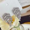 Aretes retro exquisitos estilo frío con borla de circonita, elegantes, de lujo ligero, de alta gama, personalidad, moda versátil, aretes de botón