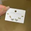 Delicado juego de pendientes de lazo de diamantes completos, exquisito para el uso diario, dulce y simple para ir al trabajo, pendientes pequeños de nicho y versátiles