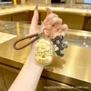 Oro puro 999 "Youqianhua" cadena para teléfono móvil de oro llavero colgante para bolso caja de regalo regalo pequeño promocional personalización cultural y creativa