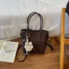 Bolso de hombro retro de nicho transfronterizo para mujer, nuevo y moderno, versátil, bandolera única, bolso cubo de moda para el día a día