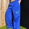 Calça casual estilo retro americano com rebite e estampa de letras, streetwear unissex, calça de moletom larga de corte solto