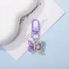 Llavero colgante de resina de color caramelo simulación de mariposa DIY accesorio de llave con cuentas de dibujos animados decoración creativa para bolsa