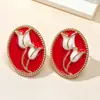 Pendientes vintage, pendientes de esmalte estilo corte retro con goteo de aceite, tachuelas de personalidad de nicho, modelo nuevo con un toque de lujo ligero de alta gama