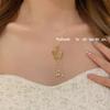 Nuevo collar de borlas de perlas y mariposas huecas de oro de estilo antiguo chino para mujer, exquisito collar de lujo ligero y combinable con todo.