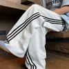 Pantalones deportivos casuales retro de estilo coreano, modernos, con bloques de color para otoño e invierno, de tres rayas, hasta el suelo, para hombre, moda de talla grande, pantalones de chándal, transfronterizo