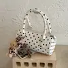 Bolso cilíndrico de moda nuevo 2026 estilo coreano transfronterizo con estampado de lunares único y moderno, versátil para llevar en la mano, al hombro y cruzado