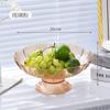 Nuevo plato de frutas de moda de lujo ligero con drenaje para el hogar simple moda sala de estar de aspecto alto transparente de plástico de pata alta plato de frutas
