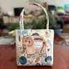 Bolso nuevo de estilo étnico, con tela color arena y bordado, un diseño fresco y casual, con bordado de hilo dorado a doble cara, una bolsa pequeña de tela y una bolsa estilo Hanfu