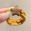 Coloridos coleteros de nuevo estilo 2026, versátiles y dulces, con accesorios de M&M's, anillos de toalla, diseños de dibujos animados y un estilo fresco y lindo, perfectos para accesorios para el cabello de niños