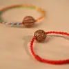 Pulseira de Caroço de Pêssego Selvagem para Bebês e Crianças, um Amuleto Protetor para o Ano de Nascimento, Pulseira Colorida de Madeira de Pêssego Trançada para Segurança