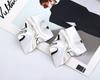 Explosiones de deseos Moda europea y americana Personalidad alternativa Metal Plegable Geométrico exagerado Cóncavo-convexo Apertura Pendientes E14100