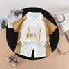 Ropa de Verano Elegante para Niño Pequeño 2026 Exportación Nuevo Estilo Conjunto de Dos Piezas con Letras, Solapa, Manga Corta y Pantalones Cortos para Niño Guapo