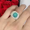 Taobao live tremolo joias rigorosamente selecionadas incrustadas com oito corações e oito flechas zircônio azul e verde imitação anel de diamante Maldivas Mosan