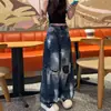 Jeans de mujer de estilo americano con estampado de grafiti rasgado y dobladillo curvo, estilo fino de verano, nuevo diseño 2026, pantalones de pierna ancha de cintura alta