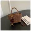 Bolso de mano de alta gama con estampado de leopardo para mujer, nuevo y elegante bolso tipo cubo retro, bolso de hombro de nicho estilo coreano