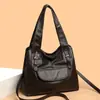 2026 Nueva Bolso Pequeño de Nicho Nueva Gran Capacidad Portátil de Hombro Moderno de Cuero Suave Moda para Mujeres de Mediana Edad Bolso de Mamá