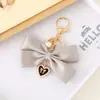 Nuevo Colgante Creativo de Cadena Colgante con Lazo de Perlas para Bolso, Funda de Teléfono, Llavero, Adorno, Exquisito Accesorio de Regalo Pequeño