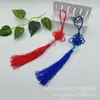 Um nó chinês puro feito à mão com peça de jade, pequeno nó chinês, borla, pingente de instrumento musical flauta Hulusi, nó chinês