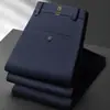 Pantalones casuales de negocios para hombre de otoño e invierno, de cintura alta, pierna recta, longitud media, elásticos, resistentes a las arrugas, pantalones de traje negros y azul oscuro