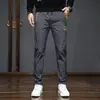 Pantalones casuales de hombre de moda china, nuevos para primavera y verano 2023, pantalones largos elásticos de cintura, bordados, versátiles, para hombre