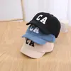 Gorra de Pana Infantil Coreana con Visera Corta Moda Otoño Hombres y Mujeres Bebé Color Sólido Bordado de Letras Gorra de Béisbol Moderna