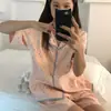 Pijama de moda de alta gama con estampado de estrellas para mujer, conjunto de dos piezas de verano con ribetes de contraste, manga corta y shorts, adecuado tanto para estar en casa como para usar al aire libre.