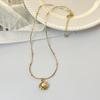 Collar de perlas naturales de agua dulce estilo francés, retro, sencillo, personalizado, chapado en cobre, con cadena de oro y colgante de nido de pájaro para mujer