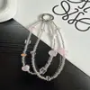 Corrente de celular original com miçangas de estrela na cor transparente, pingente de celular com miçangas para pulso, design de nicho, corrente de celular de alta qualidade