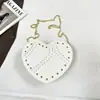 Shuai Mijia 2026 Verano Nuevo Nicho Retro Tachonado Gamuza Forma de Corazón Bolso Cruzado Bolso de Mano Casual