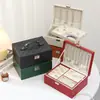Nova caixa de joias de dupla camada em formato de diamante com chave, caixa de joias portátil de mão para colares e brincos, caixa de acessórios de luxo leve