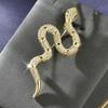 Broche en forma de serpiente de alta gama para mujer, ligero, de lujo, con diseño de nicho de circonita, ideal para suéter, traje, accesorios unisex.