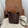 Bolso cubeta de gamuza retro de color liso, estilo coreano, nicho, ins, nuevo de otoño 2026, bandolera minimalista Maillard