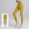 Calça de yoga Lulu de cintura alta, que levanta o bumbum e controla a barriga para mulheres, adequada para corrida e treinos, com design de quadril em formato de pêssego, e disponível em um design estilo tubarão de comprimento três quartos.