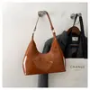 Bolso bandolera casual de cuero brillante para debajo del brazo para mujer 2026 nuevo estilo charol moderno de lujo ligero de un solo hombro bolso de mano bolso baguette