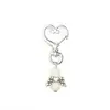 Promoção quente da Amazon chaveiro de batismo de bebê pingente de asas de anjo festa de batismo chaveiro de liga de amor