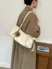 Bolsa de ombro vintage de grande capacidade 2026 nova bolsa tote de nicho estilo coreano para o dia a dia com design de cordão macio bolsa de mão