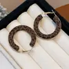 Modernos y Minimalistas Brazaletes para Oreja Retorcidos de Piedra Ojo de Tigre para Mujer, Pendientes Versátiles Vintage, Accesorios para Orejas de Otoño e Invierno con un Toque de Lujo Ligero y de Alta Gama