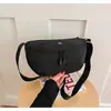 Venta al por mayor transfronteriza de bolsos cruzados de color liso para mujer, con un diseño simple, moderno y a la moda, fabricados con materiales impermeables y resistentes al desgaste, adecuados para el uso casual como bolso de pecho o riñonera.