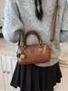 Otoño 2025 Nuevo Color Sólido Exquisita Moda Portátil Hombro Bolso Casual Bolso Mensajero de Moda de Nueva Textura para Mujer