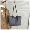 Bolsa Versátil Simples Estilo Coreano Feminina Outono 2026 Nova Moda Nicho Bolsa de Mão para o Trabalho Bolsa Tote de Grande Capacidade