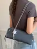 Bolso de mano a la moda y moderno estilo coreano, nuevo modelo verano 2026, bolso baguette simple y elegante, bolso de hombro casual relajado